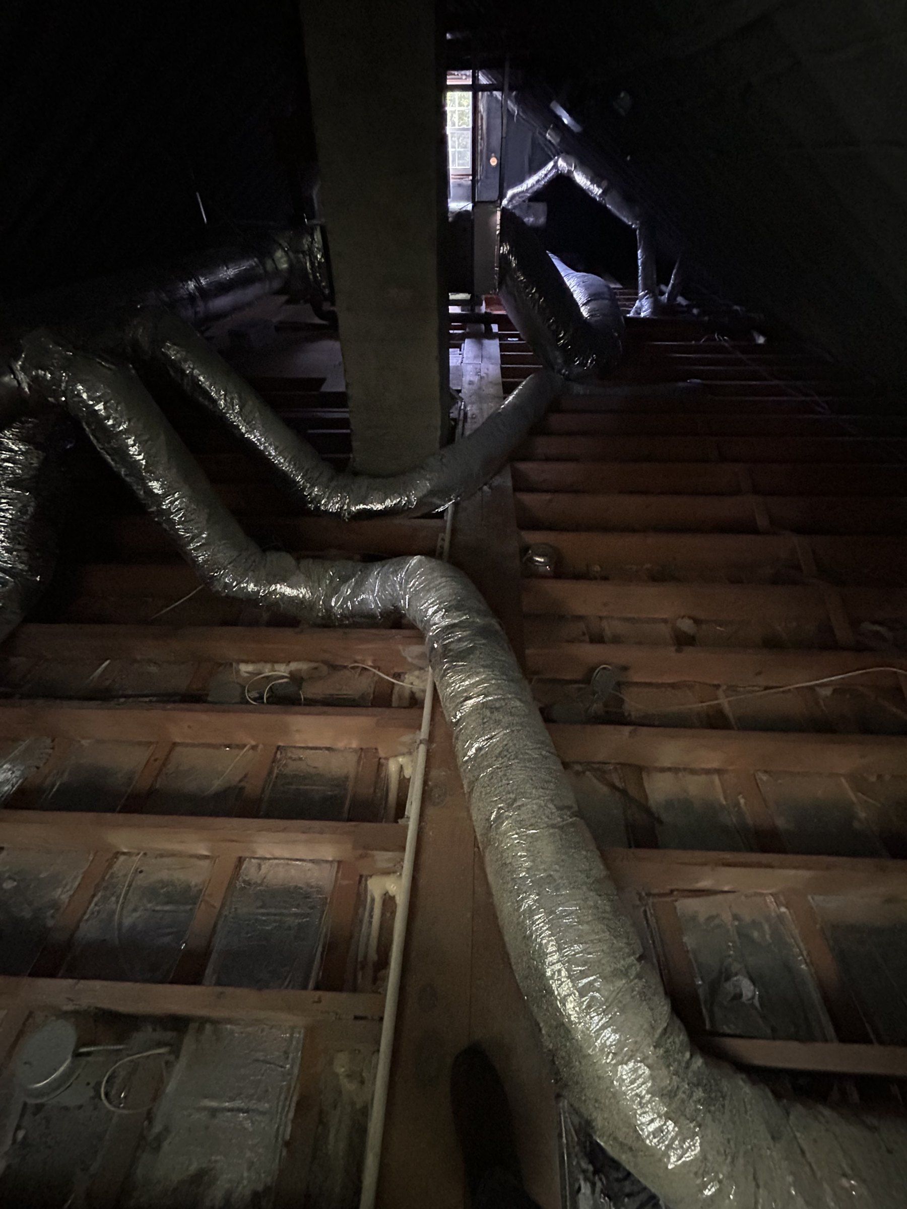 Attic floor joists landing on a center line under the ridge of a 1951 cape